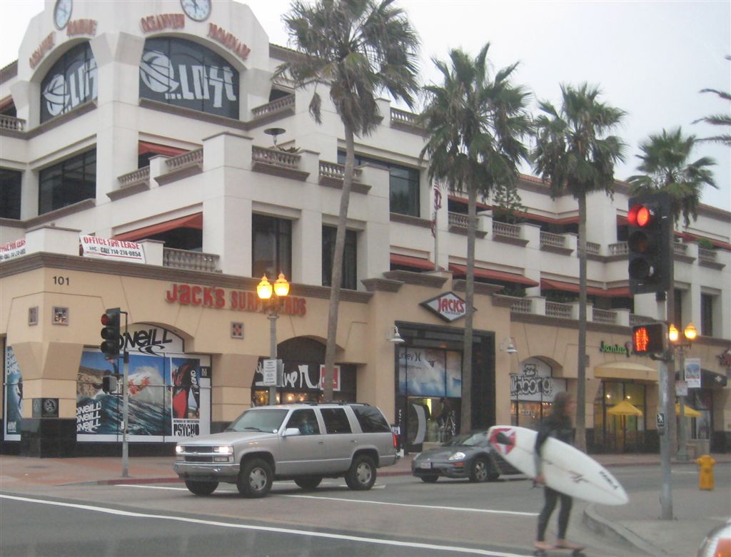 Surfer in bare feet on a skateboard.  Crazy.  :)